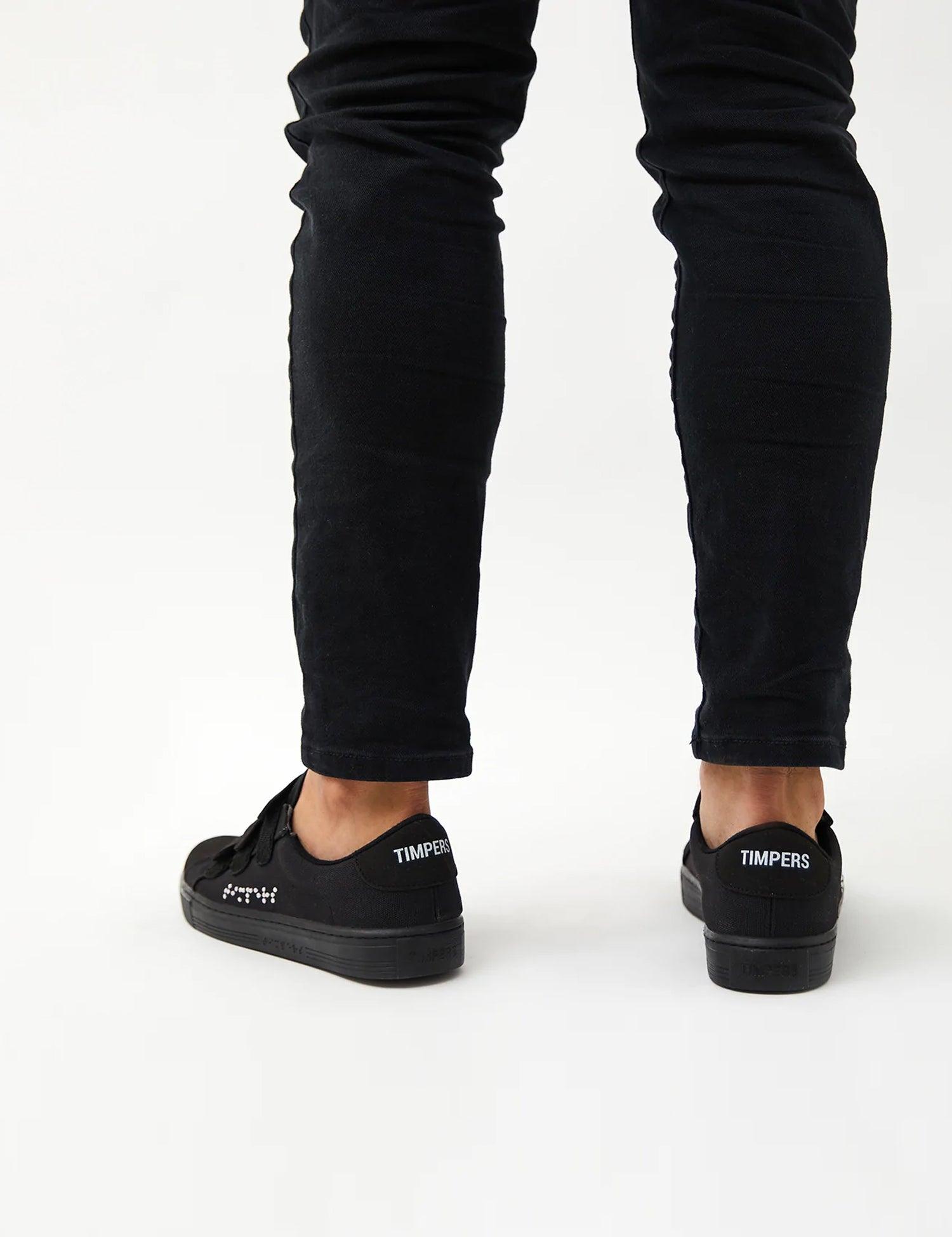 Velcro Black - Timpers Tejido de lona de color negro con tres tiras de velcro. Braille en color blanco.
